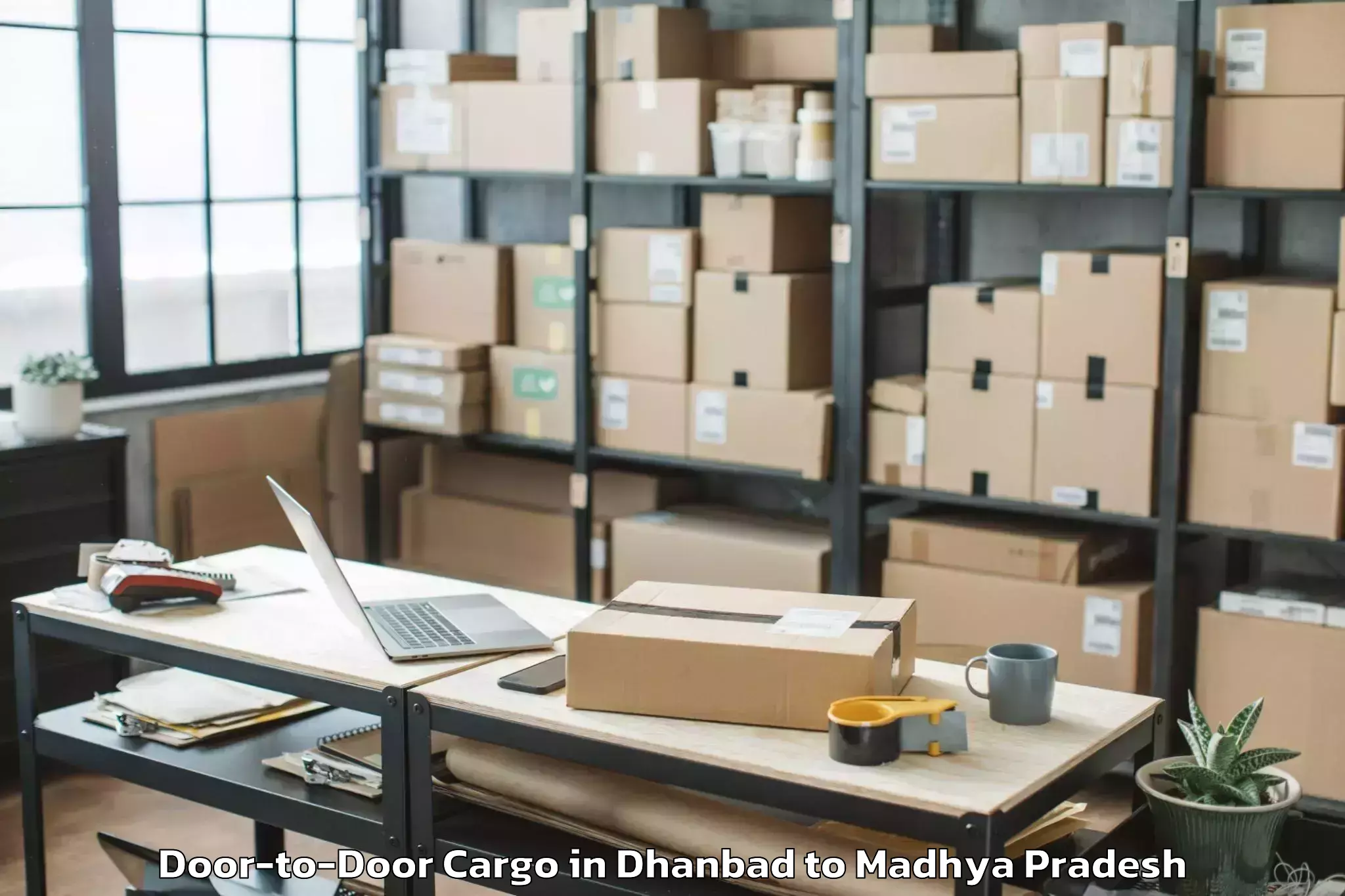 Expert Dhanbad to Shajapur Door To Door Cargo